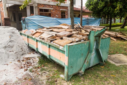 Professional team assessing property clearance requirements in Wanstead